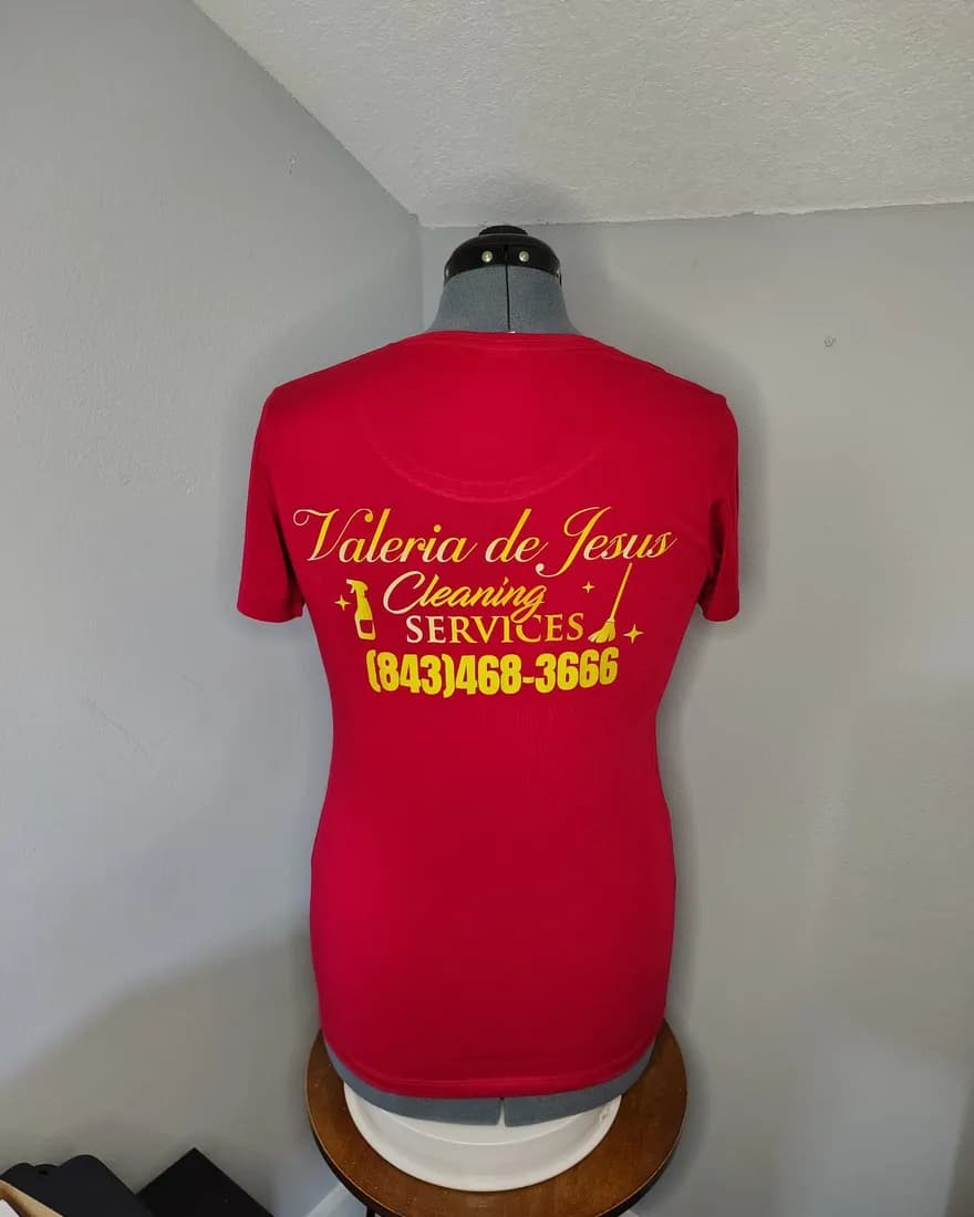 Red tee with the Valeria de Jesus Cleaning Services logo and phone number on the back
